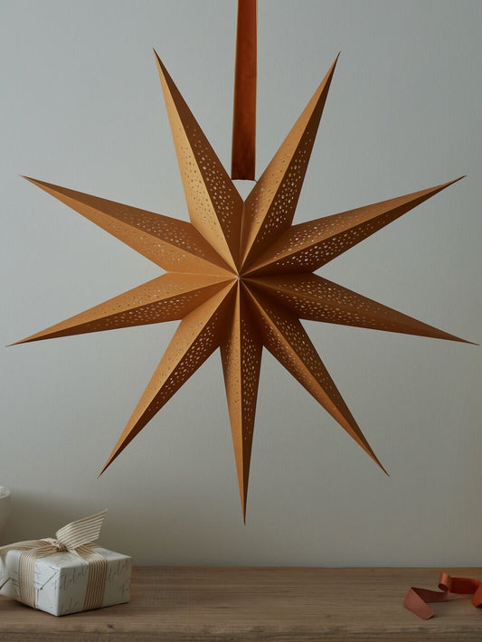 Grande étoile en papier doré détaillée